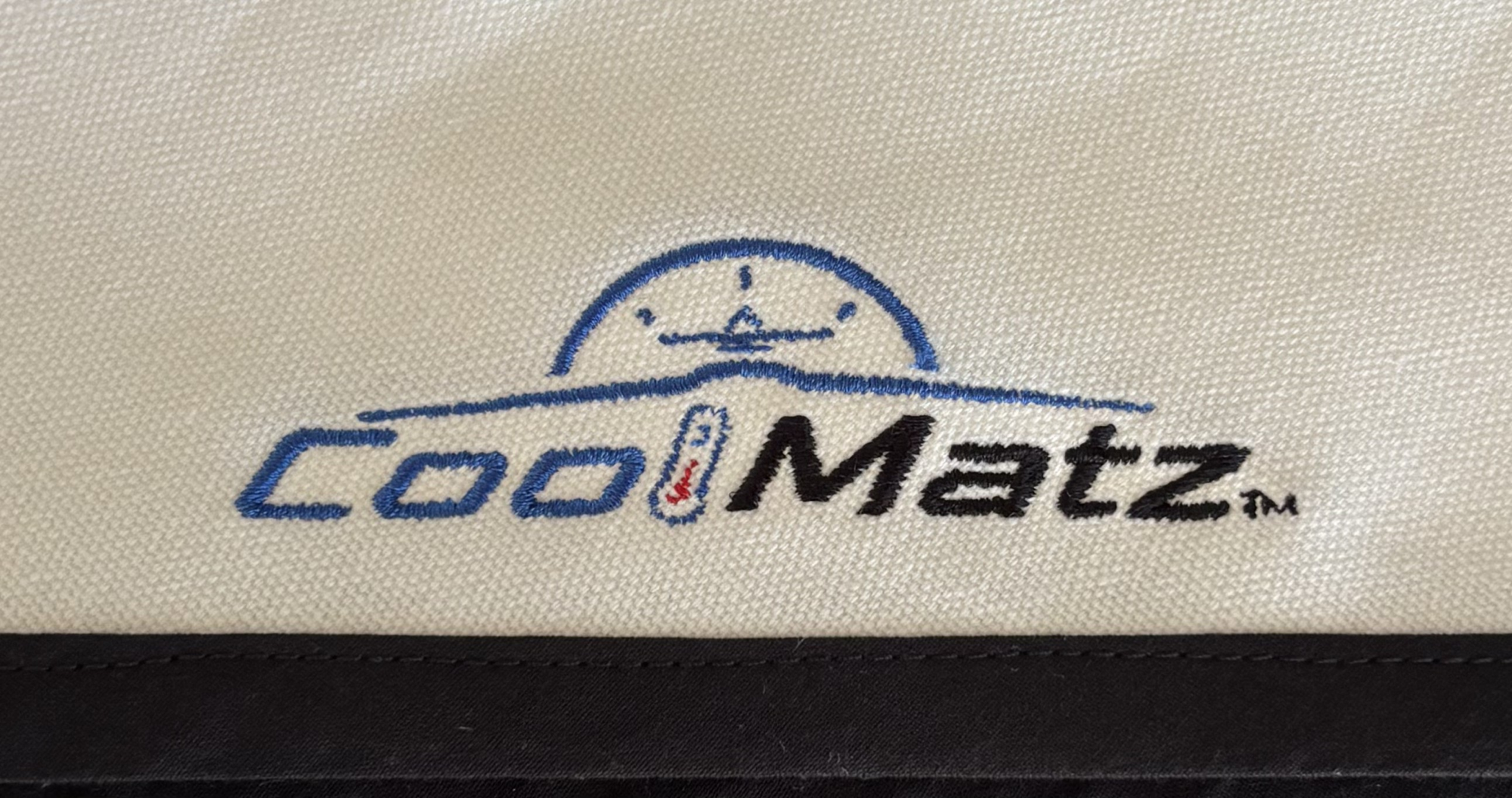 Bound edge and embroidered logo